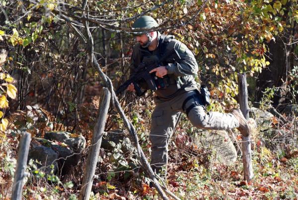 MONMOUTH, MAINE - OCTOBER 27: Law enforcement officials co<em></em>nduct a manhunt for suspect Robert Card following a mass shooting on October 27, 2023 in Monmouth, Maine. Police are actively searching for a suspect, Army reservist Robert Card, who allegedly killed 18 people in a mass shooting at a bowling alley and restaurant in Lewiston, Maine. (Photo by Joe Raedle/Getty Images)
