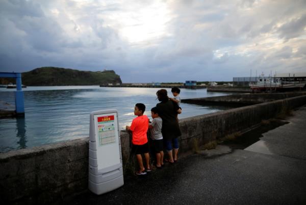 Local children look on at Japan's westernmost inhabited Yo<em></em>naguni Island in Yonaguni, Okinawa