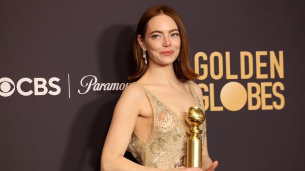 Emma Stone poses with the award for Best Performance by a Female Actor in a Motion Picture - Musical or Comedy for "Poor Things", at the 81st Annual Golden Globe Awards in Beverly Hills, California, U.S., January 7, 2024. REUTERS/Mario Anzuoni
