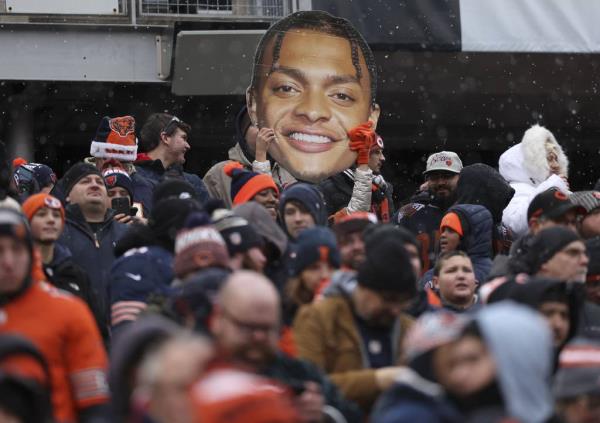 Fans cheer for Bears quarterback Justin Fields in the fourth quarter at Soldier Field on Dec. 31, 2023.