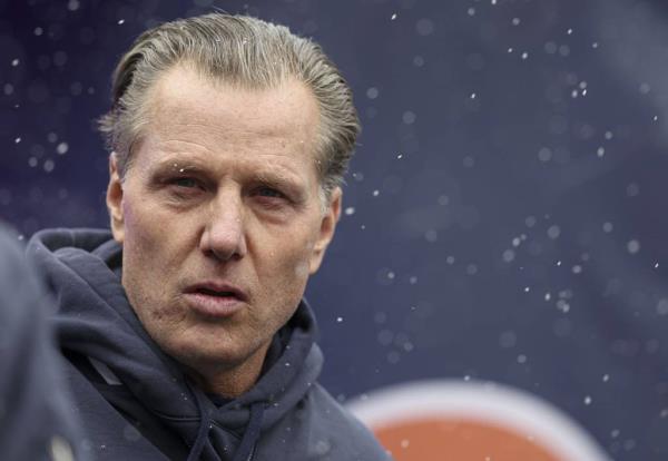Bears coach Matt Eberflus takes the field in the snow before the game against the Falcons on Dec. 31, 2023, at Soldier Field.