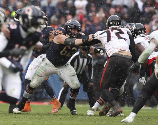 Bears guard Lucas Patrick blocks Falcons defensive end LaCale Lo<em></em>ndon on Dec. 31, 2023, at Soldier Field. 