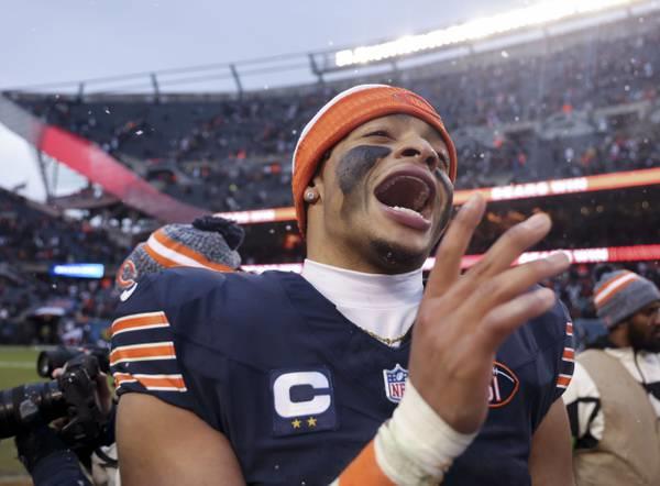 Bears coach Matt Eberflus and his players line up before the game against the Falcons in the snow on Dec. 31, 2023, at Soldier Field.