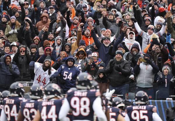 Bears fans celebrate an interception by cornerback Tyrique Stevenson in the third quarter against the Falcons on Dec. 31, 2023, at Soldier Field.