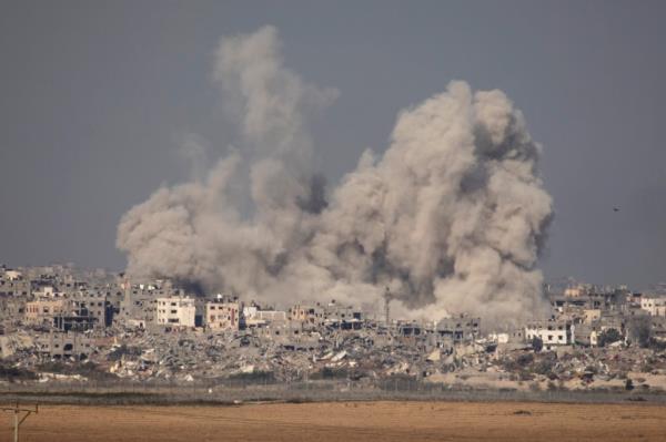 An explosion is seen over Gaza, viewed from Israel on December 8, 2023 in the Southern border, Israel.