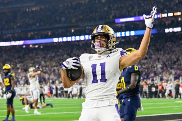 HOUSTON, TX - JANUARY 08: Washington Huskies wide receiver Jalen McMillan (11) celebrates a touchdown reception during the CFP Natio<em></em>nal Champio<em></em>nship football game between the Washington Huskies and Michigan Wolverines at NRG Stadium on January 8, 2024 in Houston, Texas. (Photo by Ken Murray/Icon Sportswire via Getty Images)