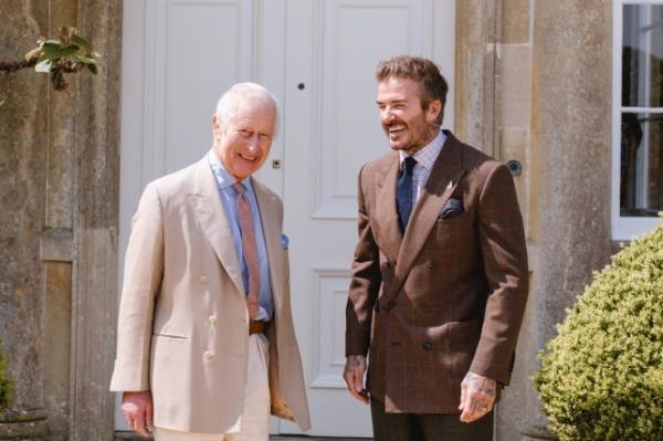 King Charles and David Beckham laughing outside Highgrove House during a visit to The King's Foundation