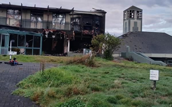The aftermath of a large fire at the abando<em></em>ned Gulf Harbour Country Club on 21 May 2024.