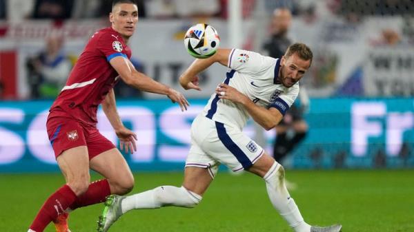 Harry Kane duels with Serbia's Nikola Milenkovic. Pic: AP