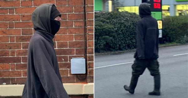 Harper walking around in a grey hoody, with dark trousers, a face covering and boots.