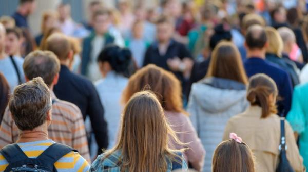 Crowd Of People On The Street.