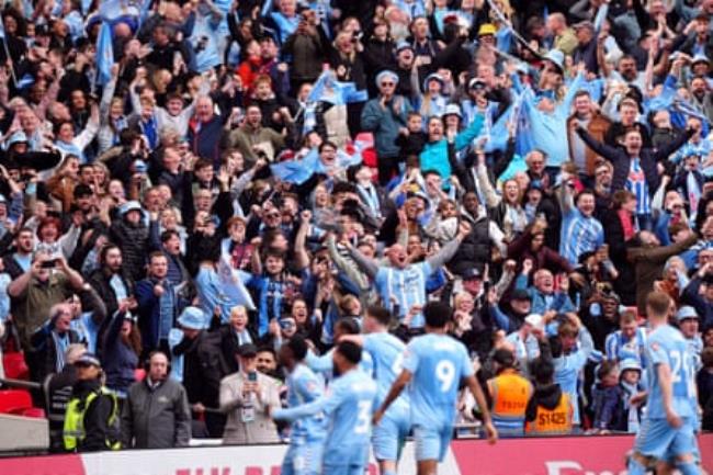 Coventry City fans celebrate their third goal, which took the semi-final into extra time