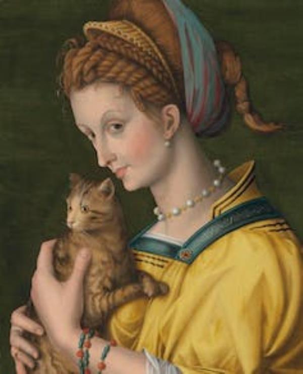 A painting of a young woman in a yellow dress, her hair wrapped in fabric and a pearl choker round her neck, holding a tabby kitten to her chest in a pose of affection.