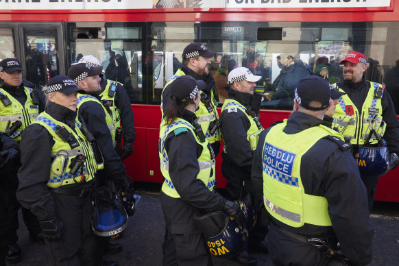 Police line the streets outside the Houses of Parliament as part of the Met Police’s ‘ring of steel’.