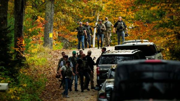 Law enforcement co<em></em>ntinue a manhunt in the aftermath of a mass shooting, in Durham, Maine, Friday, Oct. 27, 2023. Authorities are scouring hundreds of acres of family-owned property, sending dive teams to the bottom of a river and scrutinizing a possible suicide note in the second day of their intensive search for an Army reservist accused of fatally shooting several people in Maine.(AP Photo/Matt Rourke)