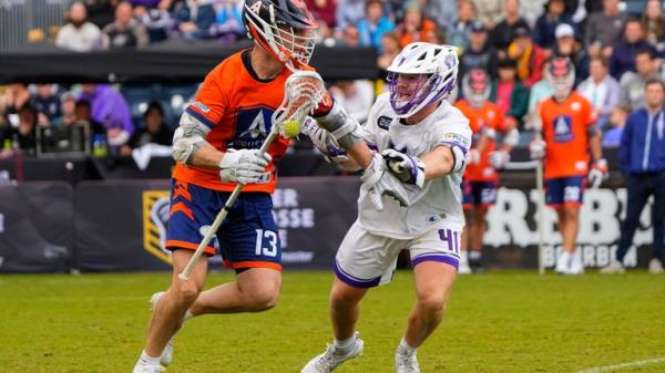 CHESTER, PA - SEPTEMBER 24: Archers Midfield Ryan Ambler (13) carries the ball against Waterdogs Defensive Midfield Jake Higgins (41) during the second half of the Premier Lacrosse League Champio<em></em>nship Game between the Archers and Waterdogs on September 24, 2023, at Subaru Park in Chester, PA. (Photo by Gregory Fisher/Icon Sportswire) (Icon Sportswire via AP Images)