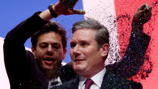 A protester throws glitter on Britain's Labour Party Leader Keir Starmer at Britain's Labour Party annual co<em></em>nference in Liverpool, Britain, October 10, 2023. REUTERS/Phil Noble