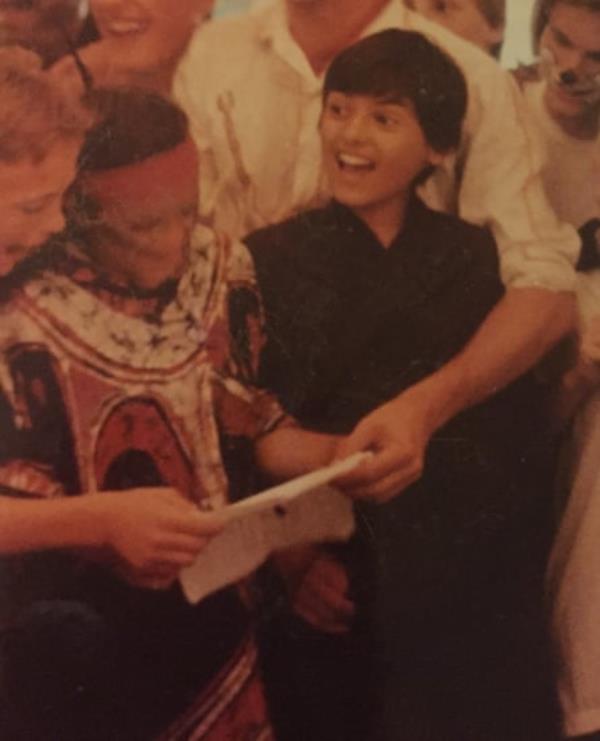 A young Tommy Nicol standing in a crowd of children.