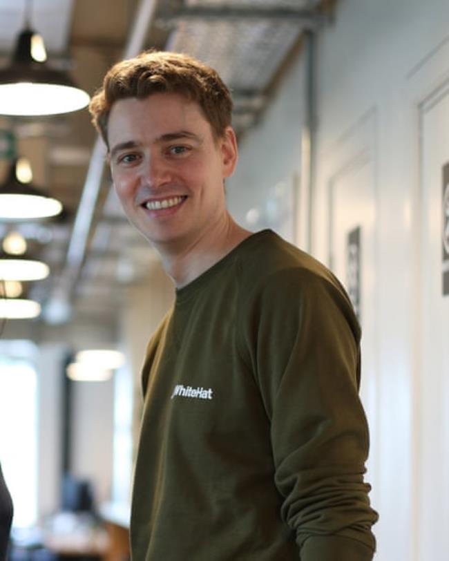 Euan Blair, casually dressed, smiles for a candid photograph