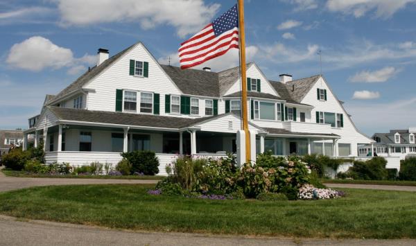 Main home in the Kennedy family compound in Hyannis Port, Massachusetts with a flag on the pole