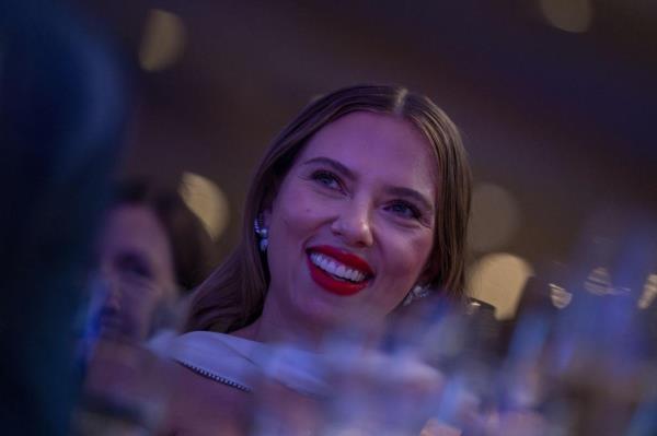 Scarlett Johansen listens to her husband, Comedian Colin Jost, speak during the White House Correspondents' Association dinner on April 27, 2024.