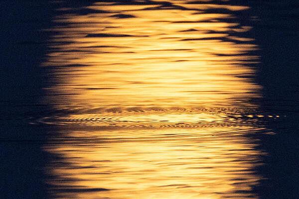 A reflection of nearly full moon known as the 