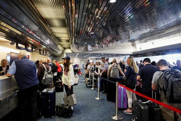 Passengers wait at Milwaukee Mitchell Internatio<em></em>nal Airport, after airlines grounded flights due to a worldwide tech outage caused by an update to CrowdStrike's 