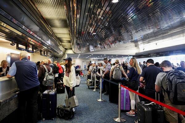 Passengers wait at Milwaukee Mitchell Internatio<em></em>nal Airport, after airlines grounded flights due to a worldwide tech outage caused by an update to CrowdStrike's 