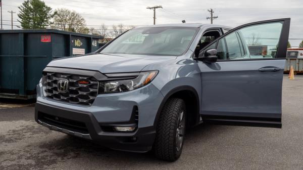 2024 Ho<em></em>nda Ridgeline TrailSport parked with driver's side door open