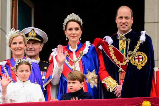 Kate, Princess of Wales, centre, waves from the balcony of Buckingham Palace with Prince William, right, Princess Charlotte, down left, and Prince Louis, down centre, during the coro<em></em>nation of Britain's King Charles III, in London, Saturday, May 6, 2023. (Leon Neal/Pool Photo via AP, File)