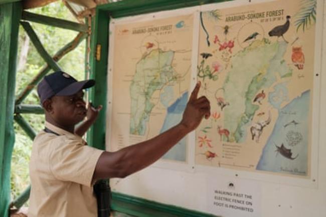 A man points to a map