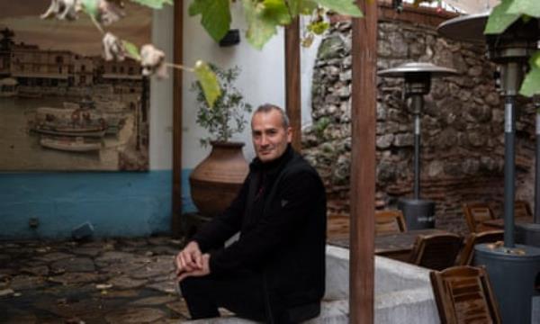 ?ükrü Golak sitting outside under some trees in the Giritli restaurant