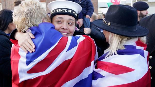 AB Yasmine Mante (centre) is greeted by family after the Royal Navy aircraft carrier HMS Prince of Wales returns to Portsmouth Naval ba<em></em>se following it's three-mo<em></em>nth deployment to the Eastern Seaboard of the United States, wher<em></em>e the Prince of Wales has been undergoing trials and operating with aircraft and drones. Picture date: Mo<em></em>nday December 11, 2023. PA Photo. See PA story DEFENCE Carrier. Photo credit should read: Andrew Matthews/PA Wire