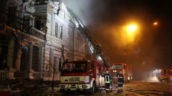 Firefighters tackle a fire after Russia's missile attack in Kharkiv on New Year's Eve. Pic: Ukrainian Emergency Service/AP