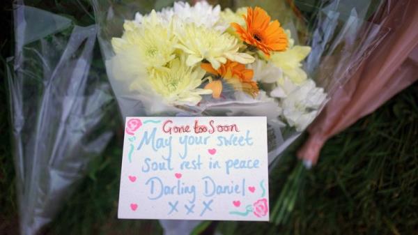 Floral tribute at floral tributes in Hainault, north east London, wher<em></em>e a 14-year-old Daniel Anjorin, was killed in a sword attack on Tuesday . Pic: PA