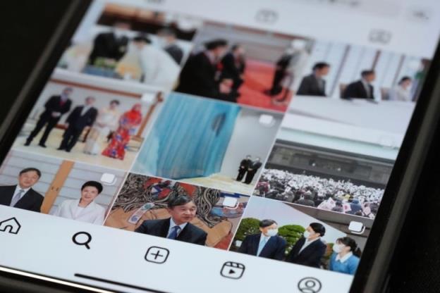 An image of a smartphone opened to instagram. The grid is photos of Japan's Imperial family.