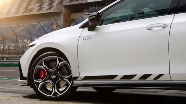 Volkswagen Golf GTI Clubsport facelift: door decal and badge detail, on a racetrack, white paint