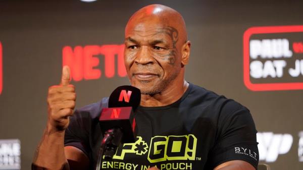 Mike Tyson gestures to the crowd during a news co<em></em>nference promoting his upcoming boxing bout against Jake Paul, Thursday, May 16, 2024, in Arlington, Texas. Pic: AP Photo/Sam Hodde