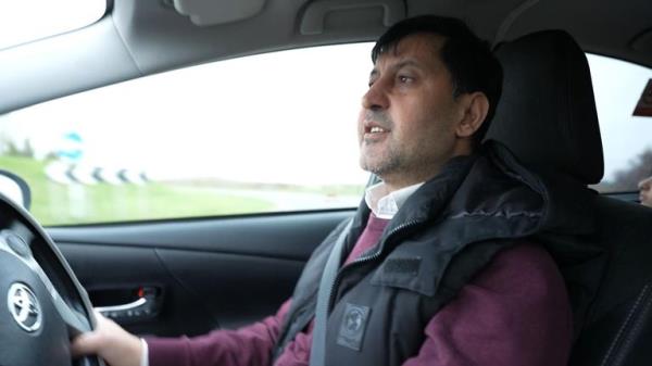 Abdullah Ahadi drives his children to school. From Adele Robinson report a<em></em>bout the housing crisis. Sky News grab