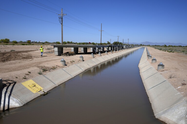A canal in the Gila River Indian Community is close to havin<em></em>g solar panels cover it Thursday, May 2, 2024, in Sacaton, Ariz. Leading the tribe is Stephen Roe Lewis, a towering figure in the Southwest who has been pivotal in navigating a water crisis across the seven-state Colorado River basin. (AP Photo/Ross D. Franklin)