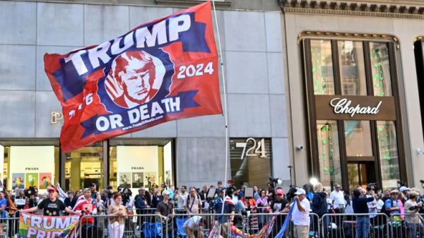 Ahead of the 11 am post hush mo<em></em>ney trial guilty verdict press co<em></em>nference today, Trump supporters and others gather outside of Trump Tower on Fifth Avenue. Pic: AP 