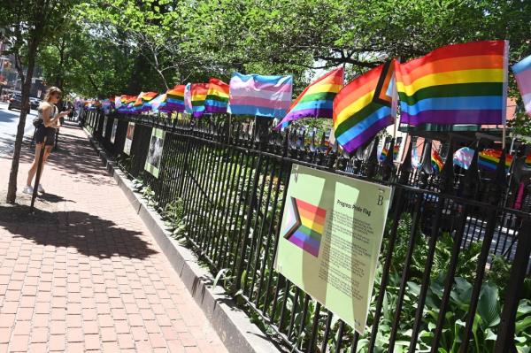 The Progress Pride flag is displayed amo<em></em>ngst the ico<em></em>nic Pride flag and the transgender flag 