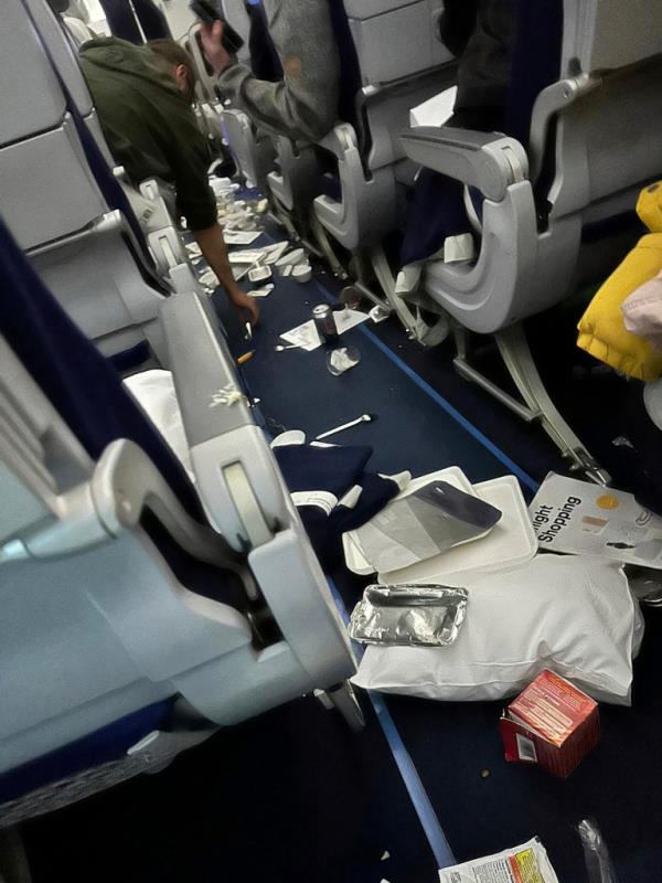 Scene of littered cabin after turbulence