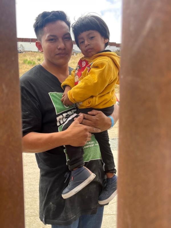 Steven holding his 2-year old, Michael