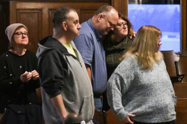 Friends and family of the late Kevin Bacon,25, react at the Shiawassee County Courthouse in Corunna, Mich. Thursday, Dec. 15, 2022, 