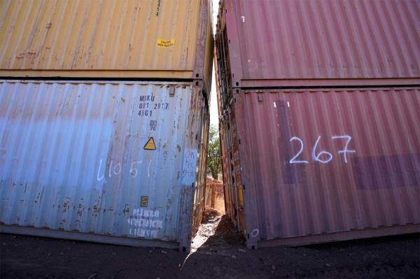 Gaps are still visible in the makeshift border 'wall.'