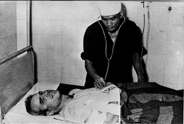 A photo taken in 1967 shows US Navy Airforce Major John McCain being examined by a Vietnamese doctor following his capture.