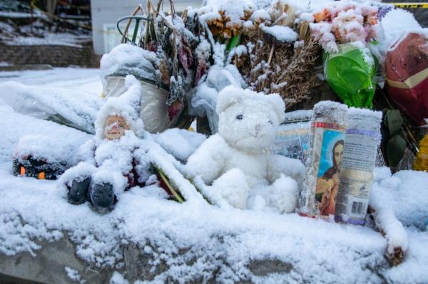 Items left at a memorial outside the house wher<em></em>e four University of Idaho students were murder sit covered in snow and frost January 20.