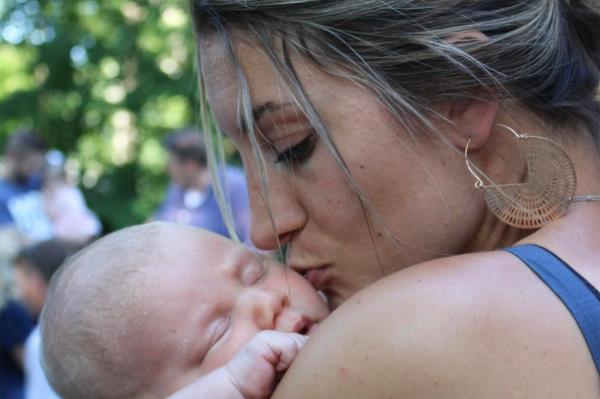 Lindsay Clancy kissing her baby