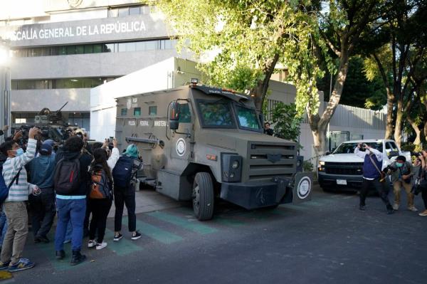 An armored transport vehicle is used to move Guzmán-López into Mexico City on Thursday.